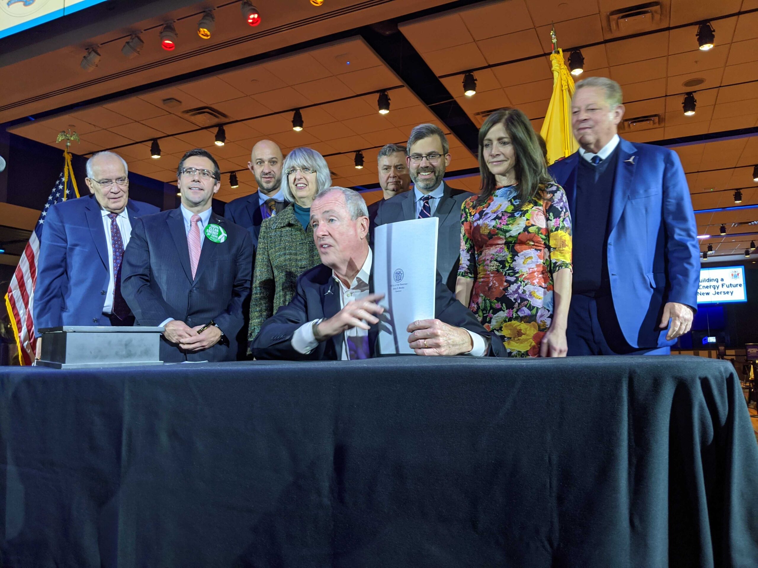 Gov. Phil Murphy is joined by former Vice President Al Gore and First Lady Tammy Murphy to sign an Executive Order to increase the state's offshore wind goal to 7,500 megawatts by 2035 at the Liberty Science Center on Nov. 19, 2019.